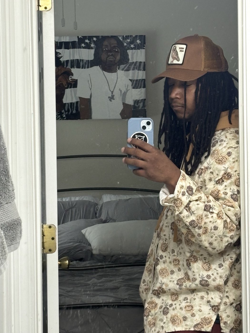 Sl1ck N°1 mirror selfie in a floral shirt